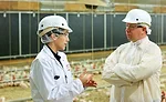 The National Provisioner's Andy Hanacek tours a Foster Farms organic chicken house with Diana Robinson
