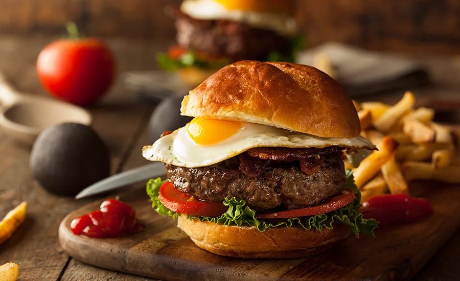 Adding protein toppers, such as pulled pork and fried eggs, provide another creative, flavorful topper for burgers