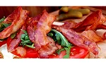 A bacon lettuce & tomato (BLT) sandwich