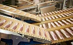 Bacon strips on a conveyor