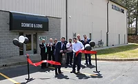Ribbon Cutting Jamie and Brad Schweid cut the ribbon to officially open the new Schweid & Sons facility in College Park, Ga.