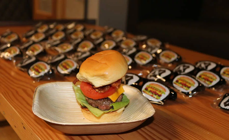 Gourmet burger sliders were served to all guests at the opening of Schweid & Sons' new facility