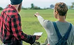 Farmers Look Out Over Crop Field