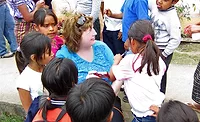 Children in Guatemala A Hormel Foods employee sits with Guatemalan children