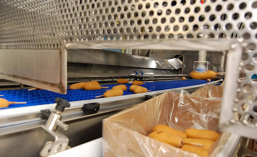 Automation such as the pick-and-place robot helps improve plant efficiency at Monogram Foods' Bristol plant
