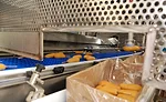 Automation such as the pick-and-place robot helps improve plant efficiency at Monogram Foods' Bristol plant