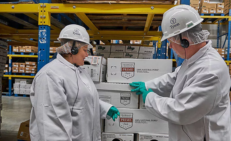 Ozlem Worpel and Andy Hanacek Look Over Boxes of Product