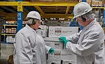 Ozlem Worpel and Andy Hanacek Look Over Boxes of Product