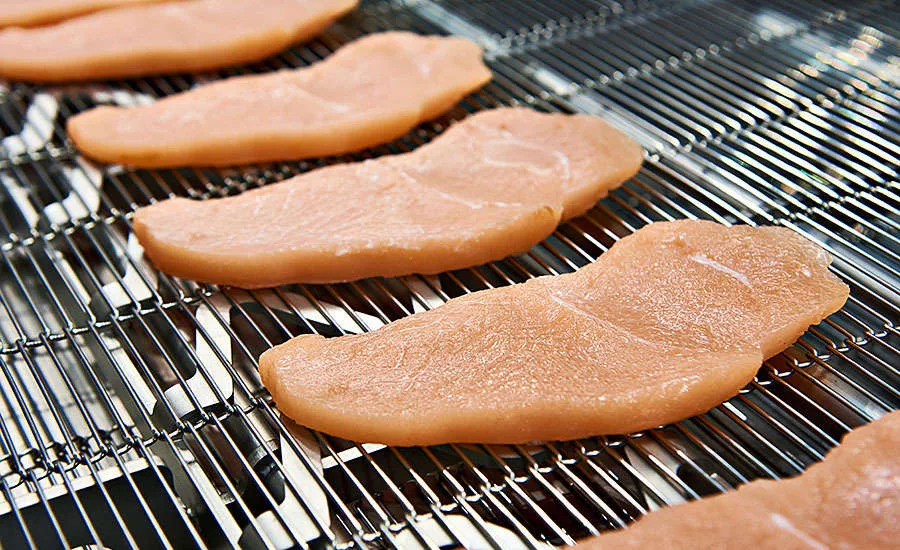 Strips of Chicken on Conveyor