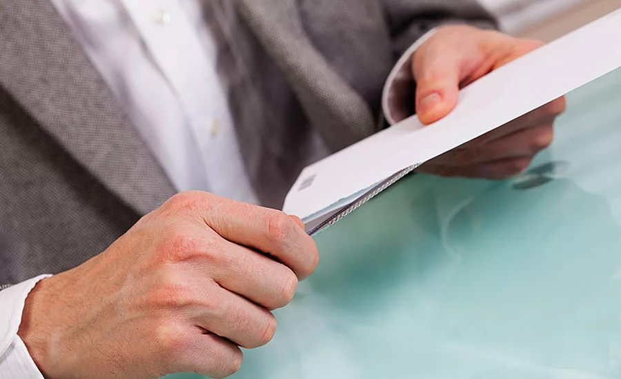 Person Opening a Letter