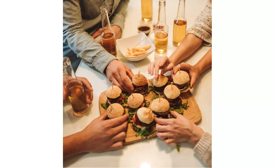 Hands Holding Hamburger Sliders