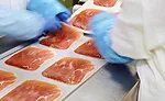 Employees Inspecting Meat