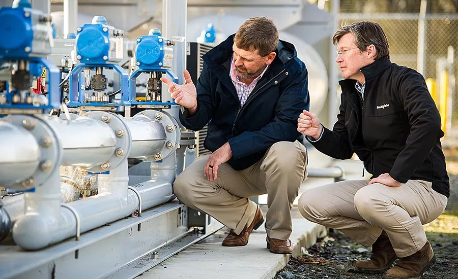 Kraig Westerbeek and Stewart Leeth Examine Smithfield Foods Equipment
