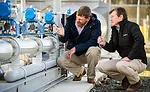 Kraig Westerbeek and Stewart Leeth Examine Smithfield Foods Equipment