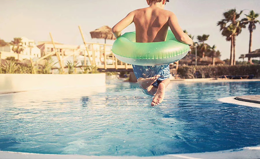 Boy Jumping Into Pool