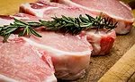 Thick Cuts of Steaks Topped With Herb