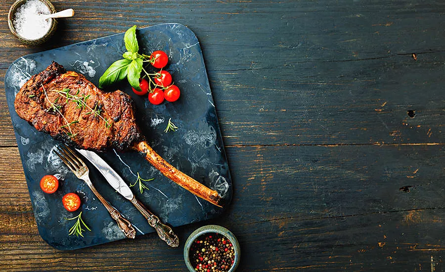 steak dinner on a board