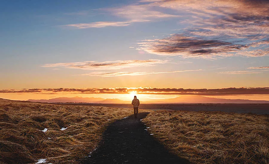 Person Hiking in the Sunset