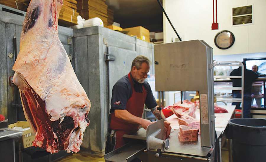 man processing meat