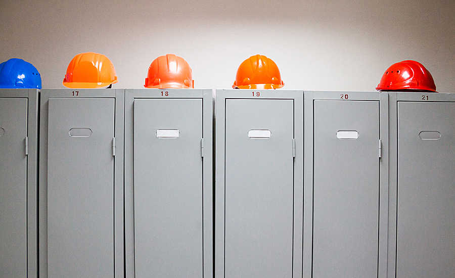 row of lockers with hard hats on top