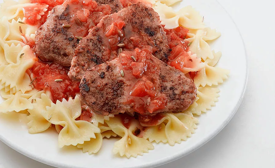 veal on noodles with a pasta sauce