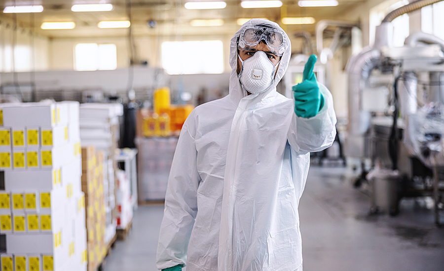 man in foodservice safety apparel giving thumbs up