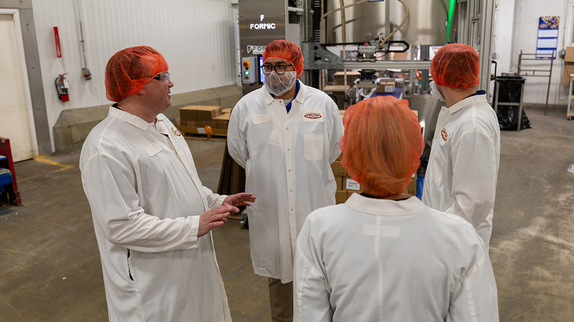 Land O’Frost team members review operations on the production floor at the company’s Lansing facility.