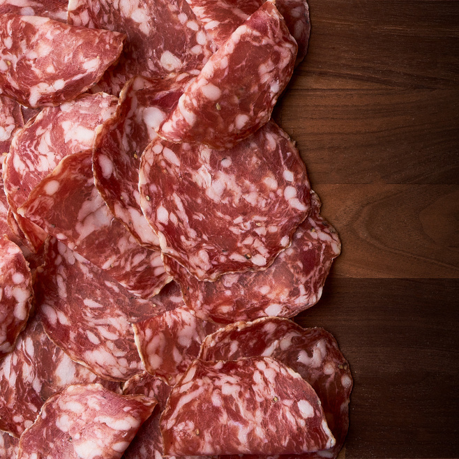 Fra Mani Soppressata on a board.