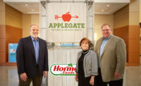 Neil Leinwand and Kerry Collins of Applegate join Tom Day of Hormel Foods in the Austin, Minn., headquarters.
