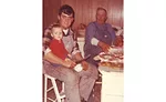 An old family photo of Sam Western introducing son Kevin to meat processing