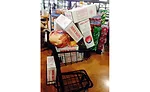 A cart loaded with Dewig Meats products inside the retail store