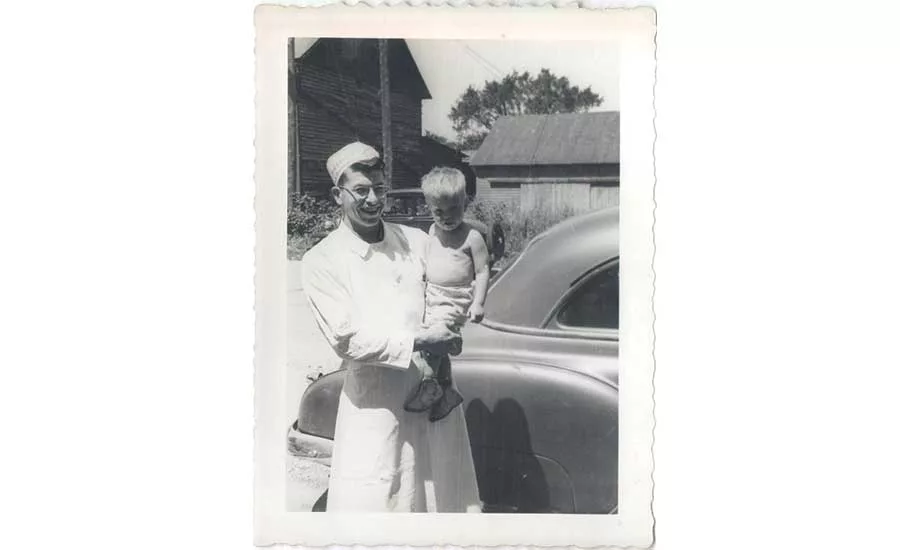 Merlyn Eickman poses with his son Mike