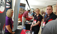 Students gather at one of the booths at the 70th Reciprocal Meat Conference