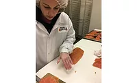 Shuckman's Employee Hand-Slices Fish
