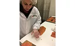 Shuckman's Employee Hand-Slices Fish