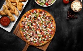 Round Table Pizza debuts Greek-style pizza, the Apollo