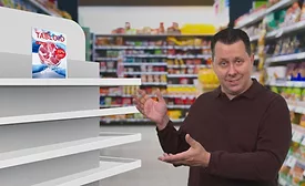 Andy Hanacek Pointing to Fake Meat Tabloid